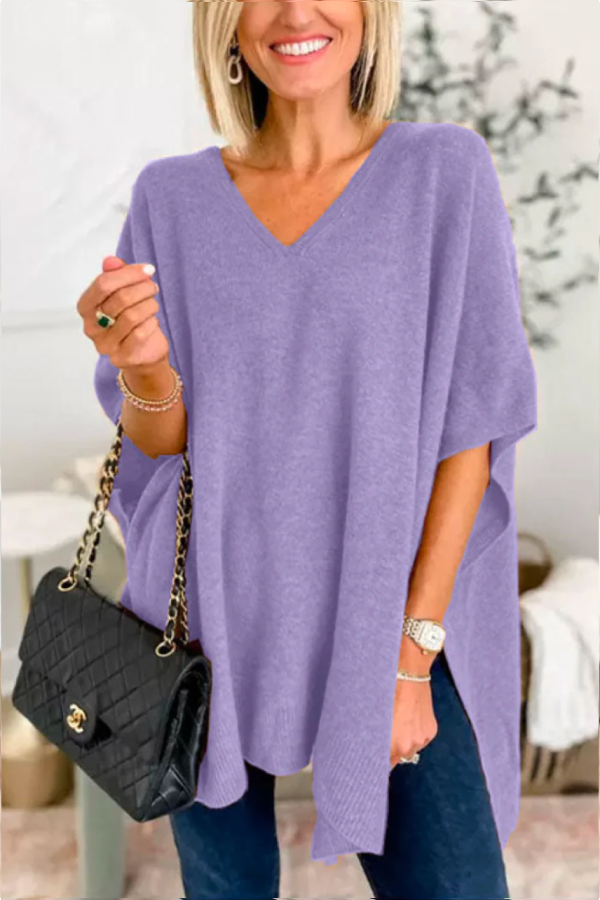 Suéter tipo poncho holgado de color liso con cuello en V