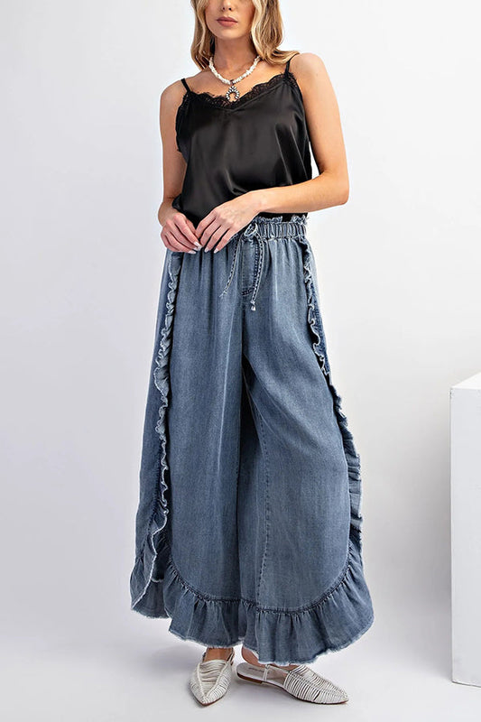 Pantalones vaqueros holgados acampanados con cintura elástica y volantes de color liso