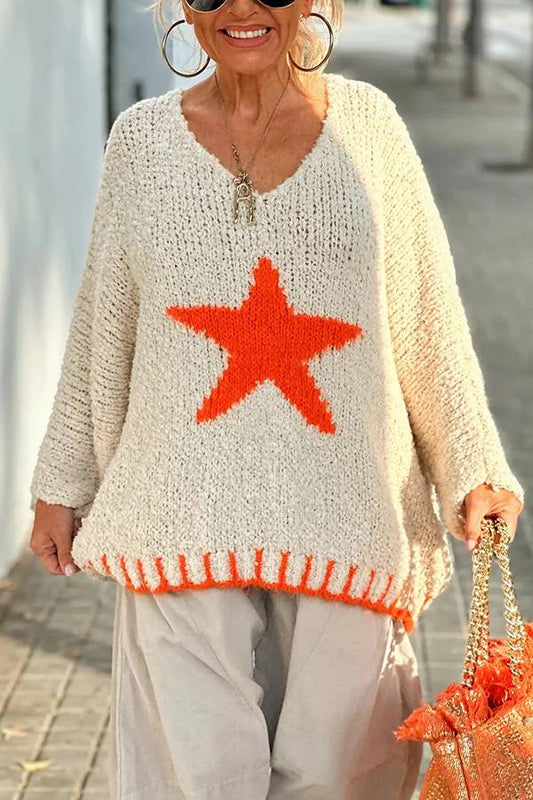 Suéter holgado con textura de punto y estampado de estrellas en color contrastante para un cálido día de invierno
