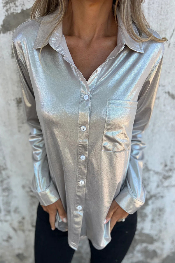 Blusa holgada con botones y bolsillos metalizados de aspecto festivo