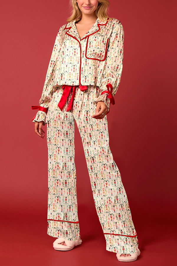Conjunto de top de terciopelo con estampado navideño, manga larga, bolsillos y pantalones anchos con cintura elástica.