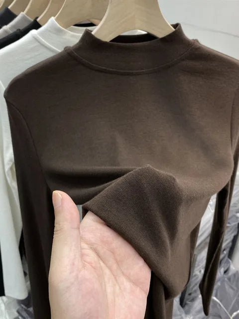 Camiseta básica blanca de algodón puro de alta calidad para mujer, elegante top ajustado de cuello alto y manga larga.