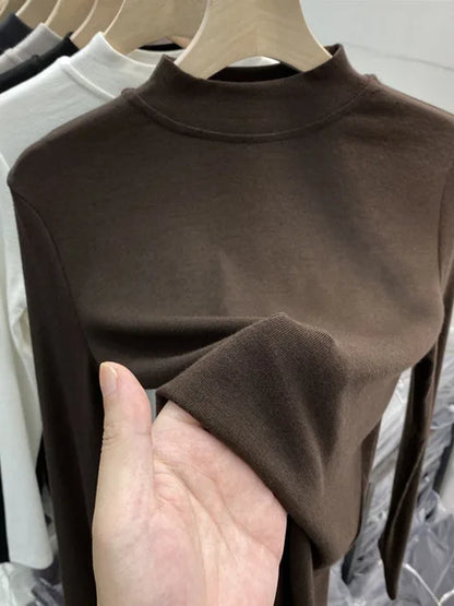 Camiseta básica blanca de algodón puro de alta calidad para mujer, elegante top ajustado de cuello alto y manga larga.