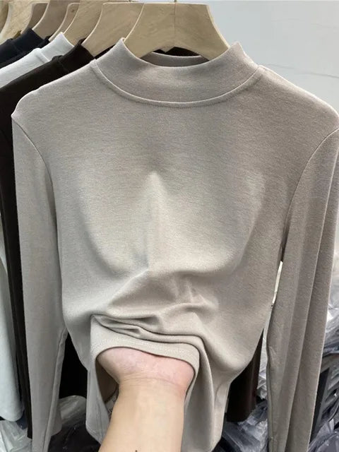 Camiseta básica blanca de algodón puro de alta calidad para mujer, elegante top ajustado de cuello alto y manga larga.