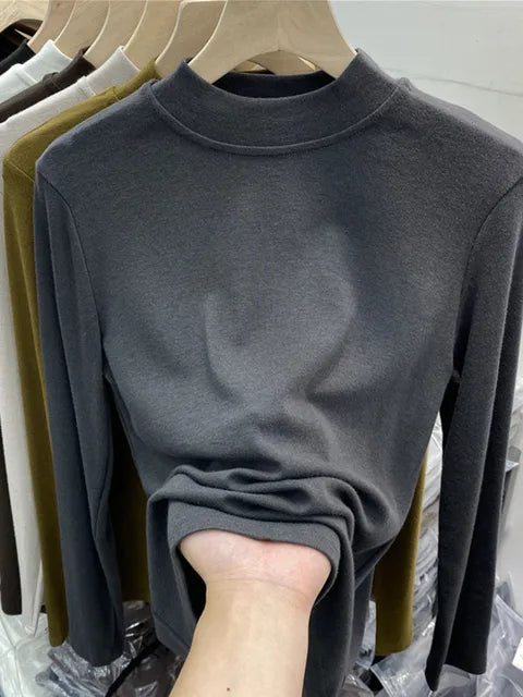 Camiseta básica blanca de algodón puro de alta calidad para mujer, elegante top ajustado de cuello alto y manga larga.