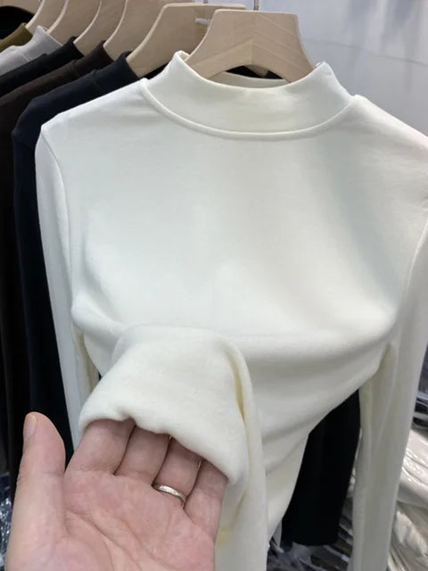 Camiseta básica blanca de algodón puro de alta calidad para mujer, elegante top ajustado de cuello alto y manga larga.