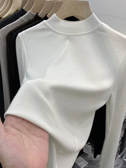 Camiseta básica blanca de algodón puro de alta calidad para mujer, elegante top ajustado de cuello alto y manga larga.