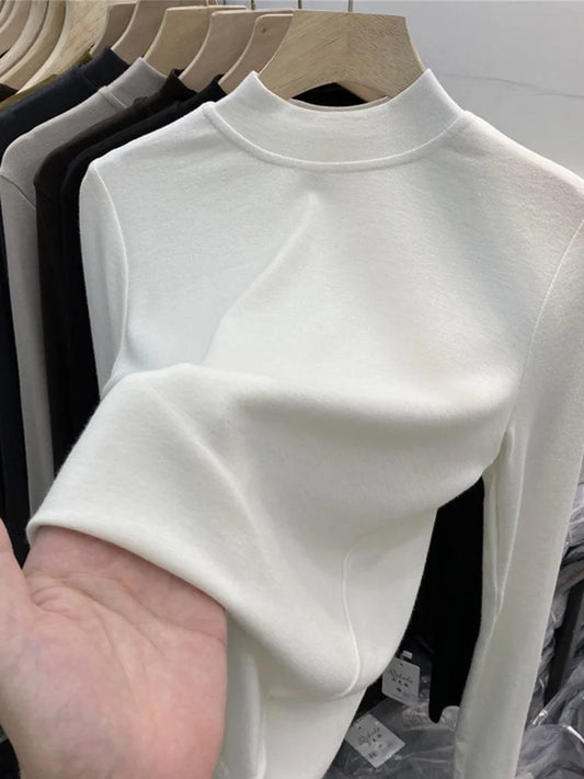Camiseta básica blanca de algodón puro de alta calidad para mujer, elegante top ajustado de cuello alto y manga larga.
