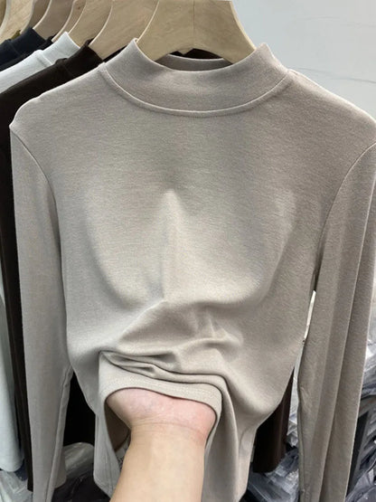 Camiseta básica blanca de algodón puro de alta calidad para mujer, elegante top ajustado de cuello alto y manga larga.