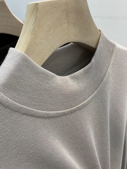 Camiseta básica blanca de algodón puro de alta calidad para mujer, elegante top ajustado de cuello alto y manga larga.