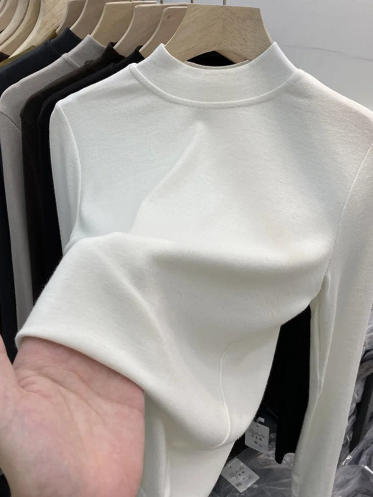 Camiseta básica blanca de algodón puro de alta calidad para mujer, elegante top ajustado de cuello alto y manga larga.