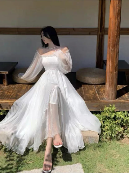 Elegantes vestidos de playa para vacaciones de verano para mujer, color blanco liso, con mangas abullonadas, cuello oblicuo, hombros descubiertos, vestidos de gasa de moda coreana.