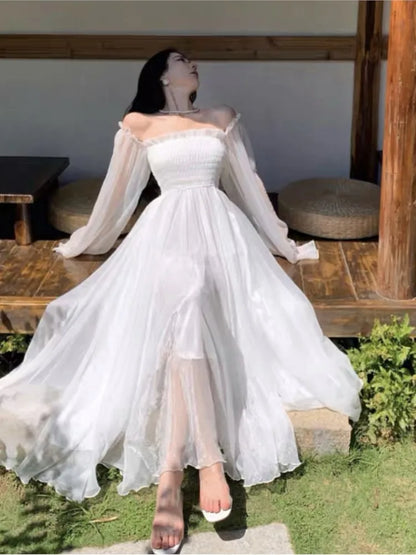 Elegantes vestidos de playa para vacaciones de verano para mujer, color blanco liso, con mangas abullonadas, cuello oblicuo, hombros descubiertos, vestidos de gasa de moda coreana.