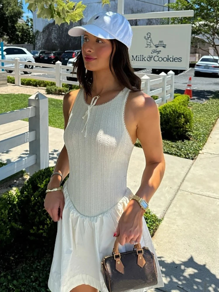 Fantoye - Vestido corto femenino de verano sin mangas, corte en A, sexy, con espalda descubierta, cuello redondo, holgado e informal