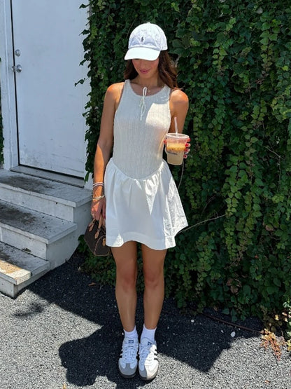 Fantoye - Vestido corto femenino de verano sin mangas, corte en A, sexy, con espalda descubierta, cuello redondo, holgado e informal