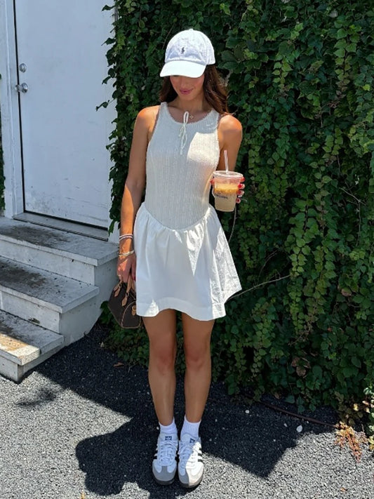 Fantoye - Vestido corto femenino de verano sin mangas, corte en A, sexy, con espalda descubierta, cuello redondo, holgado e informal