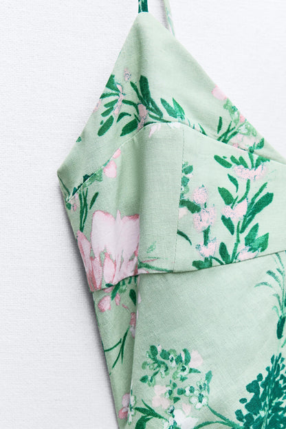 Vestido midi sin mangas con abertura floral 