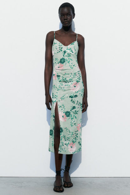 Vestido midi sin mangas con abertura floral 