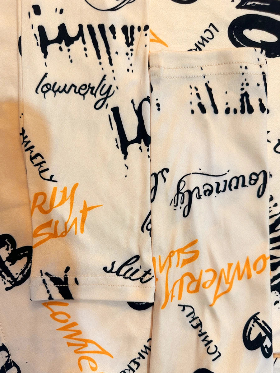 Conjunto de dos piezas de pantalón ajustado con estampado de letras y top corto para mujer, cuello redondo de alta elasticidad, otoño e invierno, 2025