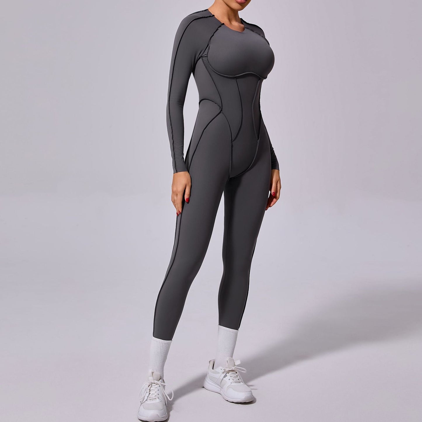 Mono deportivo de yoga de una pieza de otoño e invierno con espalda descubierta y pantalones ajustados de manga larga.