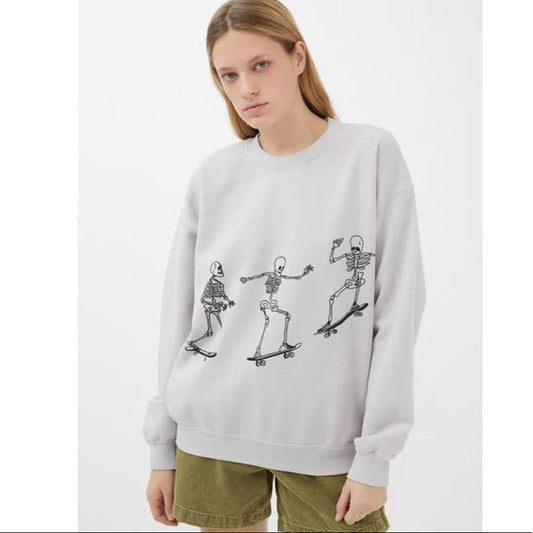 Otoño Invierno mujeres usan manga larga color sólido calavera patineta impresión suelta casual mangas largas
