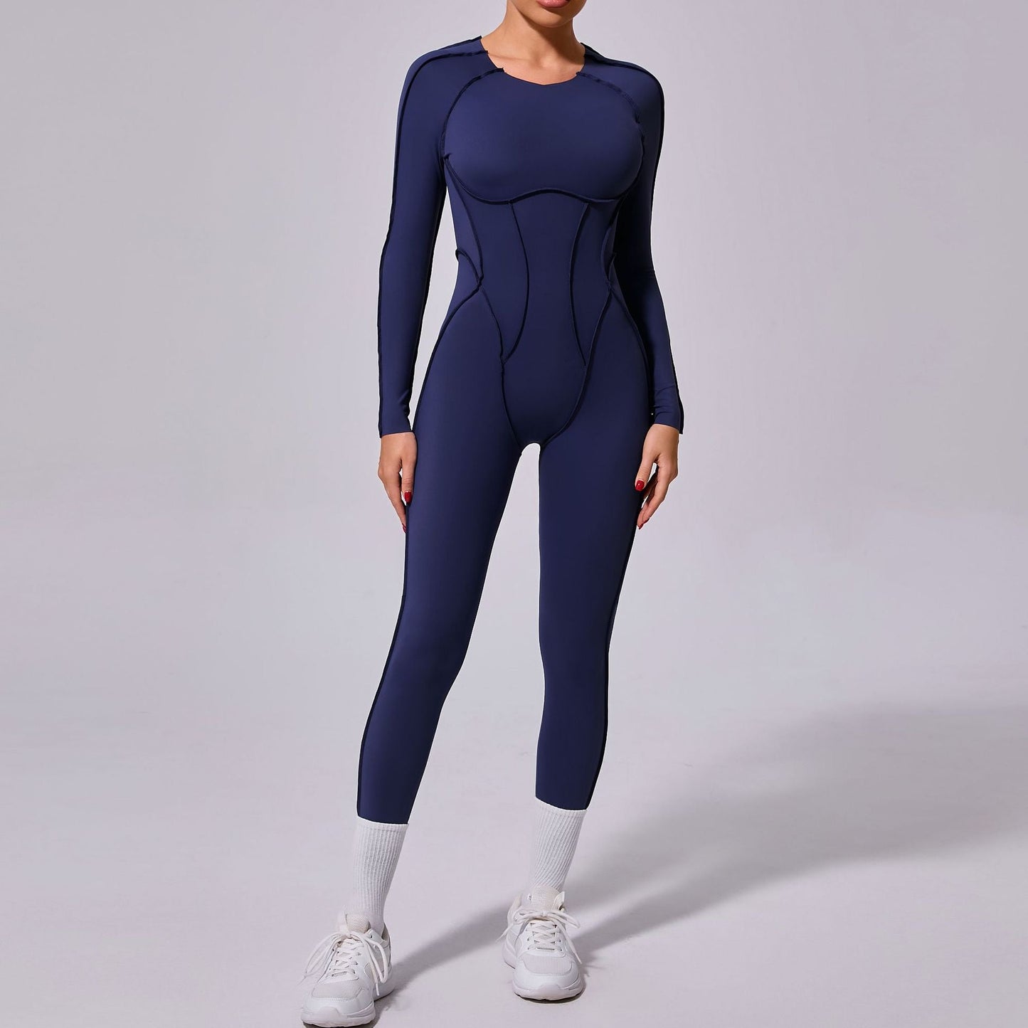 Mono deportivo de yoga de una pieza de otoño e invierno con espalda descubierta y pantalones ajustados de manga larga.