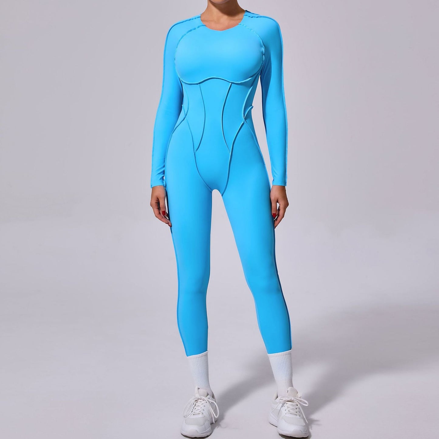 Mono deportivo de yoga de una pieza de otoño e invierno con espalda descubierta y pantalones ajustados de manga larga.