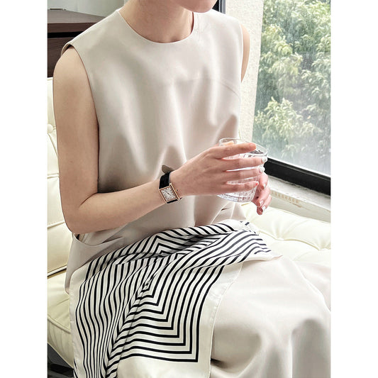 Vestido de oficina sencillo y elegante, sin mangas, holgado, con cuello redondo y corte recto.