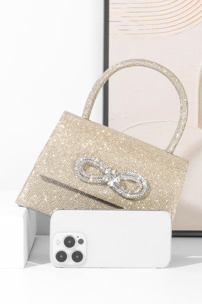 Bolso con asa de diamante y brillo metálico 