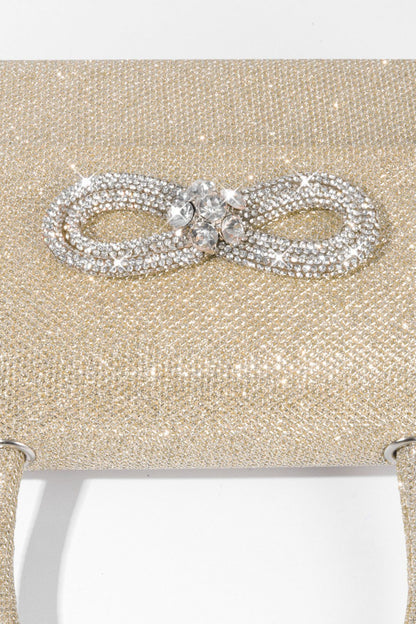 Bolso con asa de diamante y brillo metálico 