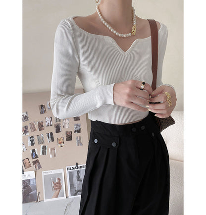 Suéter corto con cuello de pétalo para mujer, camisa de otoño ajustada con clavícula.