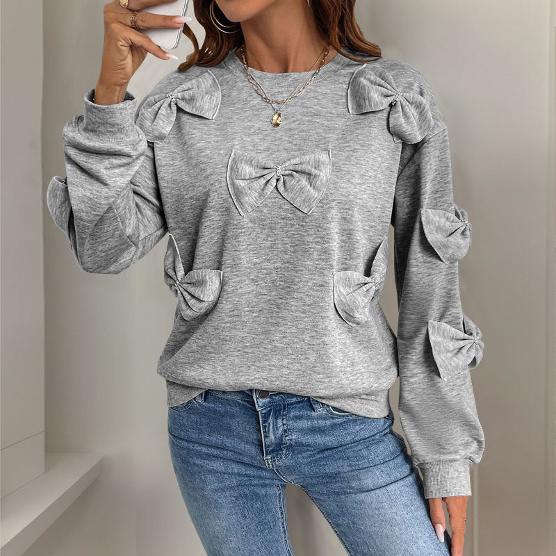 Sudadera informal de otoño con cuello redondo y costuras de lazo en gris