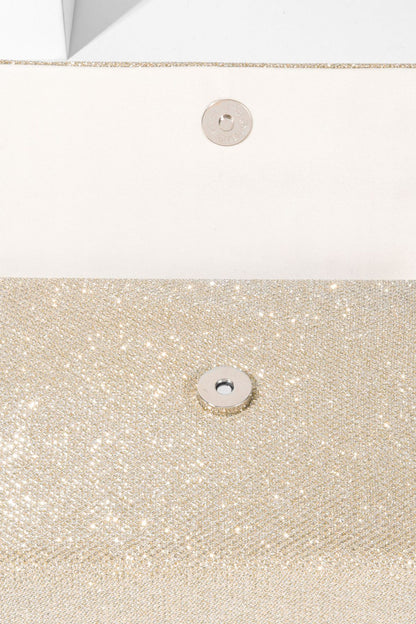 Bolso con asa de diamante y brillo metálico 