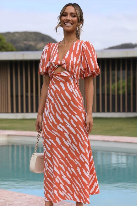 Vestido midi con abertura y escote en V, mangas abullonadas y estampado 