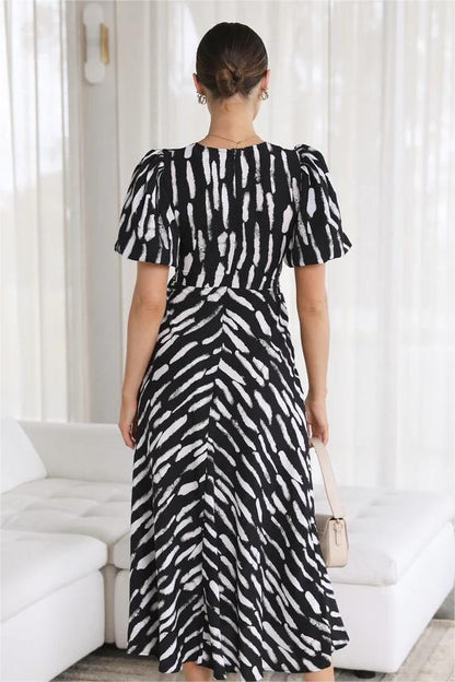 Vestido midi con abertura y escote en V, mangas abullonadas y estampado 