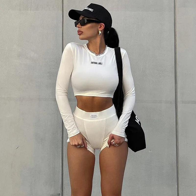 Conjunto deportivo versátil de dos piezas de manga corta, cuello redondo, pantalones cortos 3/4 y estilo europeo y americano para primavera/verano para mujer
