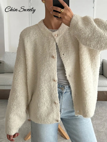 Suéter elegante de manga larga para mujer, cárdigan liso holgado de un solo pecho con cuello redondo, ropa de abrigo suave y a juego para primavera 2025.