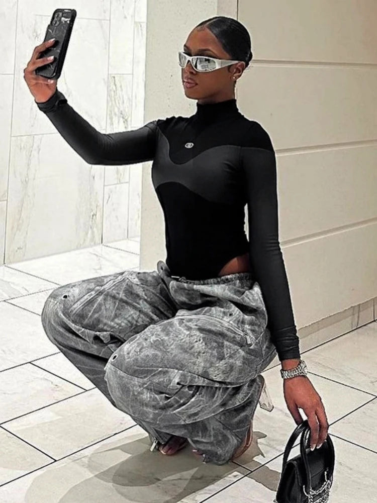 Body de manga larga con cuello alto para mujer, lencería sexy, top negro, mono de una pieza de PU con retazos