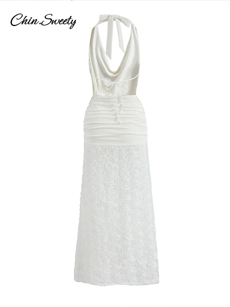 Vestido largo blanco sexy con cuello halter, espalda descubierta, plisado, con flores 3D y escote halter, ideal para fiestas de verano 2025 en la playa.