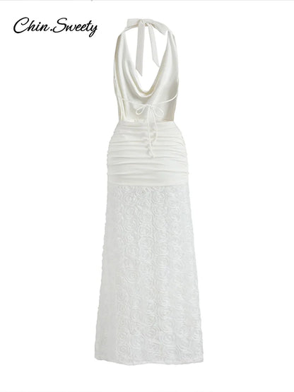 Vestido largo blanco sexy con cuello halter, espalda descubierta, plisado, con flores 3D y escote halter, ideal para fiestas de verano 2025 en la playa.