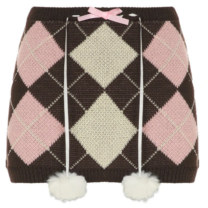 Faldas de punto otoñales con rombos, bonitas y dulces, a cuadros, con bolas de peluche y lazos, a la moda.