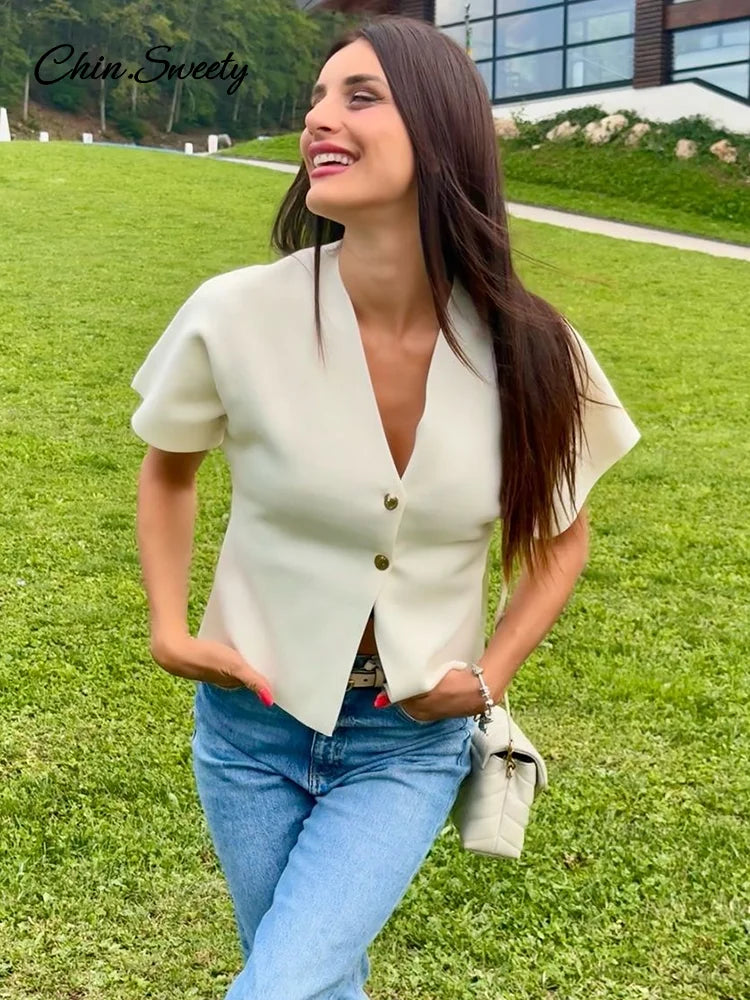 Chaleco de punto de moda para mujer, manga corta, cuello en V, botones, holgado, blanco, tipo cárdigan, otoño, novedad en prendas exteriores.