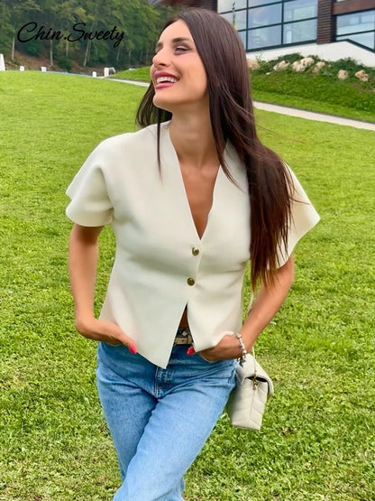 Chaleco de punto de moda para mujer, manga corta, cuello en V, botones, holgado, blanco, tipo cárdigan, otoño, novedad en prendas exteriores.