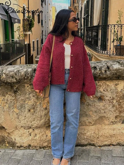 Suéter elegante de manga larga para mujer, cárdigan liso holgado de un solo pecho con cuello redondo, ropa de abrigo suave y a juego para primavera 2025.