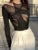 Body de malla sexy transparente con aberturas irregulares para mujer, cuello redondo, mangas largas, elástico, para fiesta y club