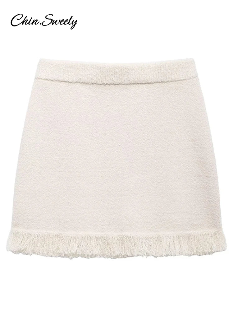 Conjunto de falda de punto con borlas de moda para mujer, cárdigan de manga larga con cuello redondo y hebilla de lazo, suéter y minifalda, nuevo conjunto a juego.