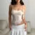 Top de tirantes con volantes de flores para mujer, elegante y sexy, a la moda, sin mangas, con dobladillo estético, camisetas de tirantes, conjuntos de verano para la calle