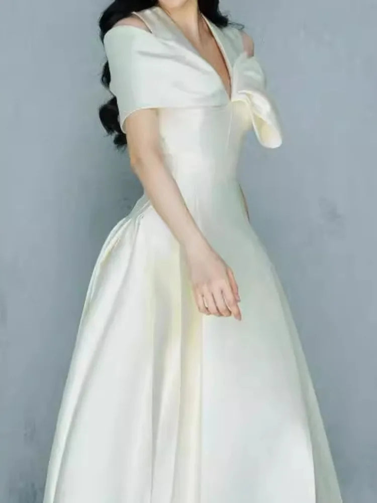 Elegante vestido largo estilo hada, escote en V, cintura hueca, lazo 3D, bolsillo, vestidos de fiesta de moda para mujer, primavera-verano 2025, 23A9338