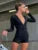 Mono negro liso ajustado de manga larga para mujer, ropa informal de una pieza, mono con cuello en V y botones, ropa de calle sexy