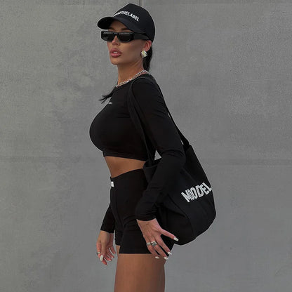 Conjunto deportivo versátil de dos piezas de manga corta, cuello redondo, pantalones cortos 3/4 y estilo europeo y americano para primavera/verano para mujer